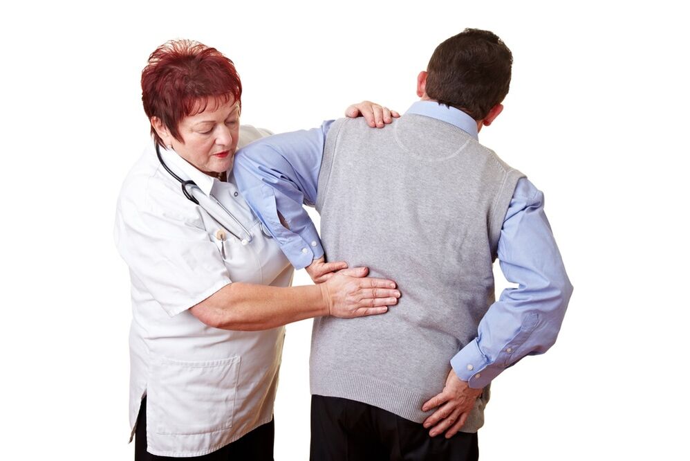 the doctor examines the back for pain