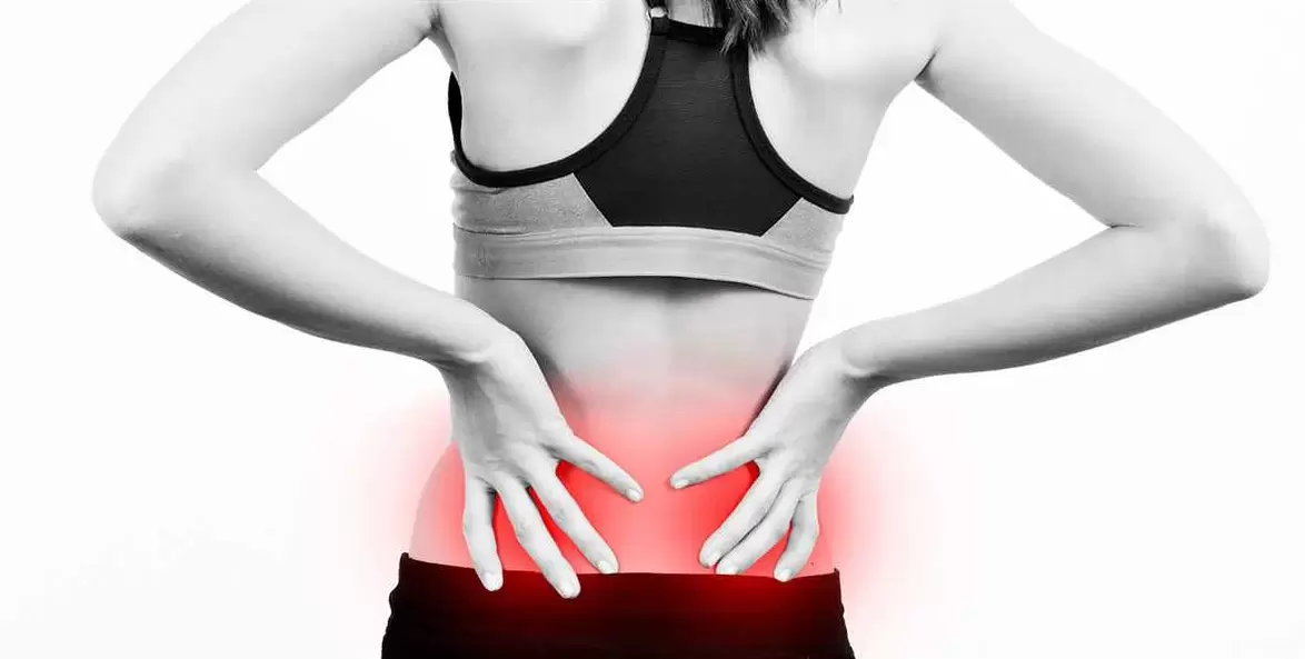 Pain in the lumbar region, which can be relieved by exercises and correct body position