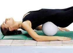 Exercise with a cushion under the lower back